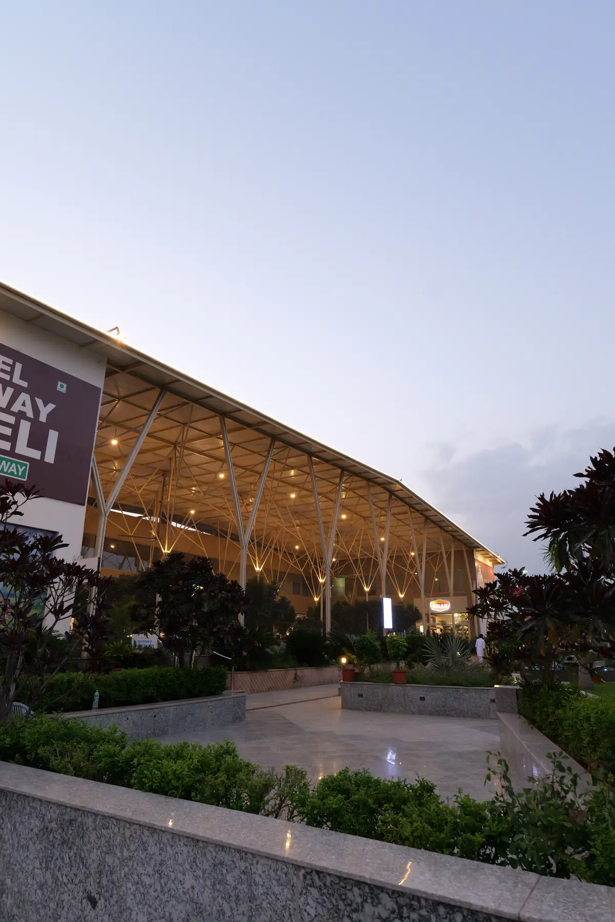 The steel canopy lit up at dusk