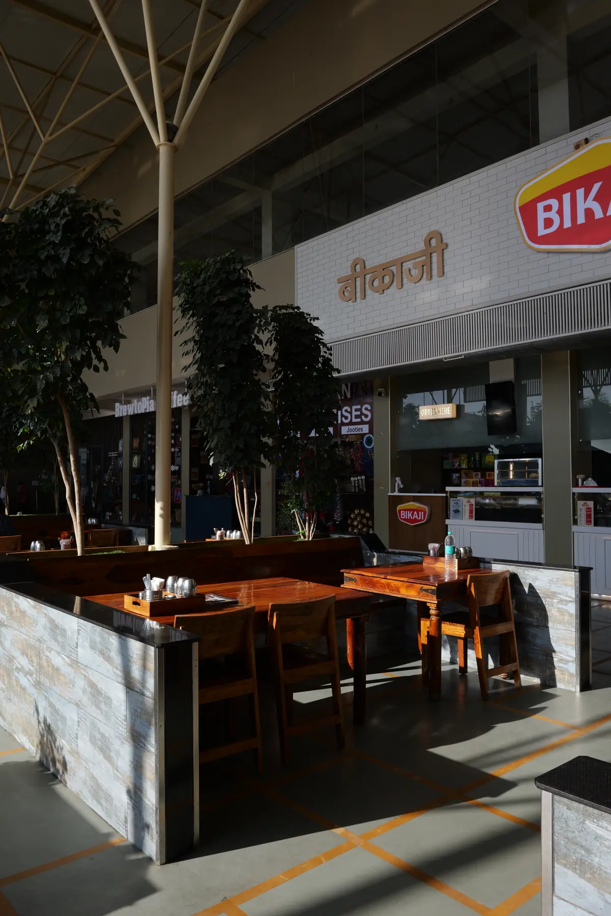 Dining tables beside the food counters