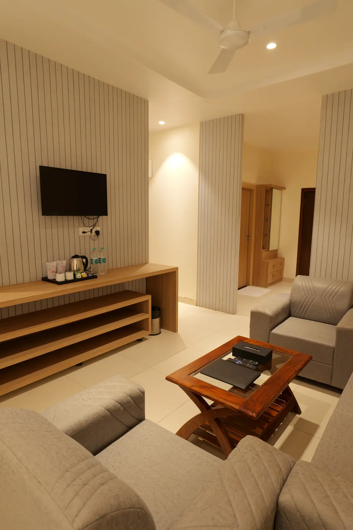 Suite with TV unit, tea and coffee station and lounge chair