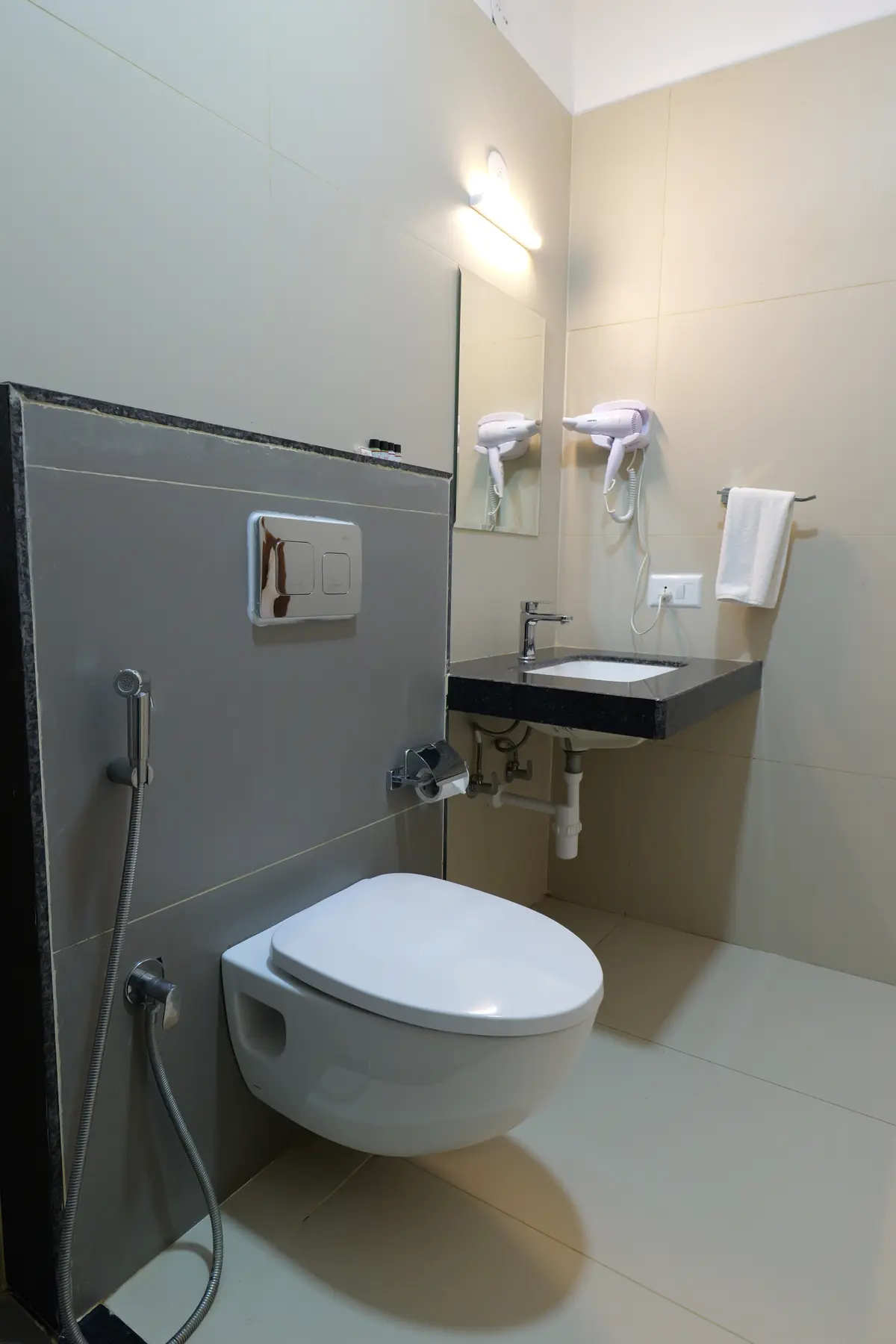 Bathroom with vanity, hair dryer and fresh towels