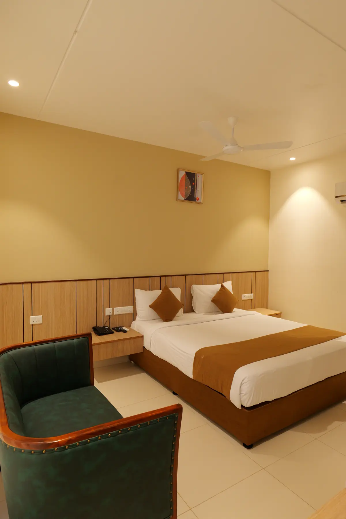 Guest room with bed and armchair