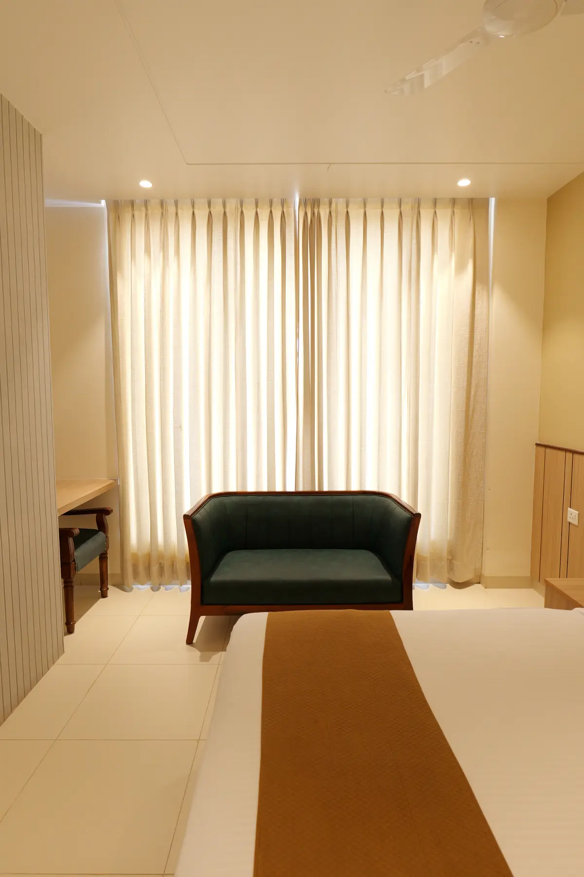 Loveseat by the window in a guest room